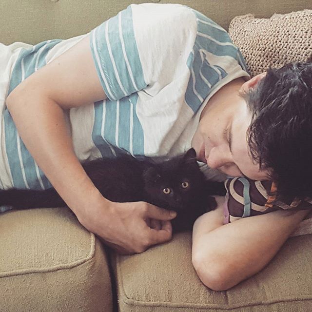 Luna caught snuggling Ryan. #caturday #kittensnuggles #blackcatsofinstagram #blackkitty #blackkitten #boyfriendsleeping